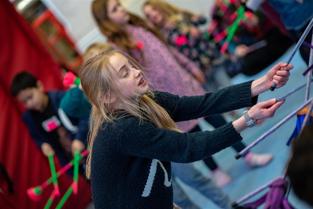 Children trying circus skills