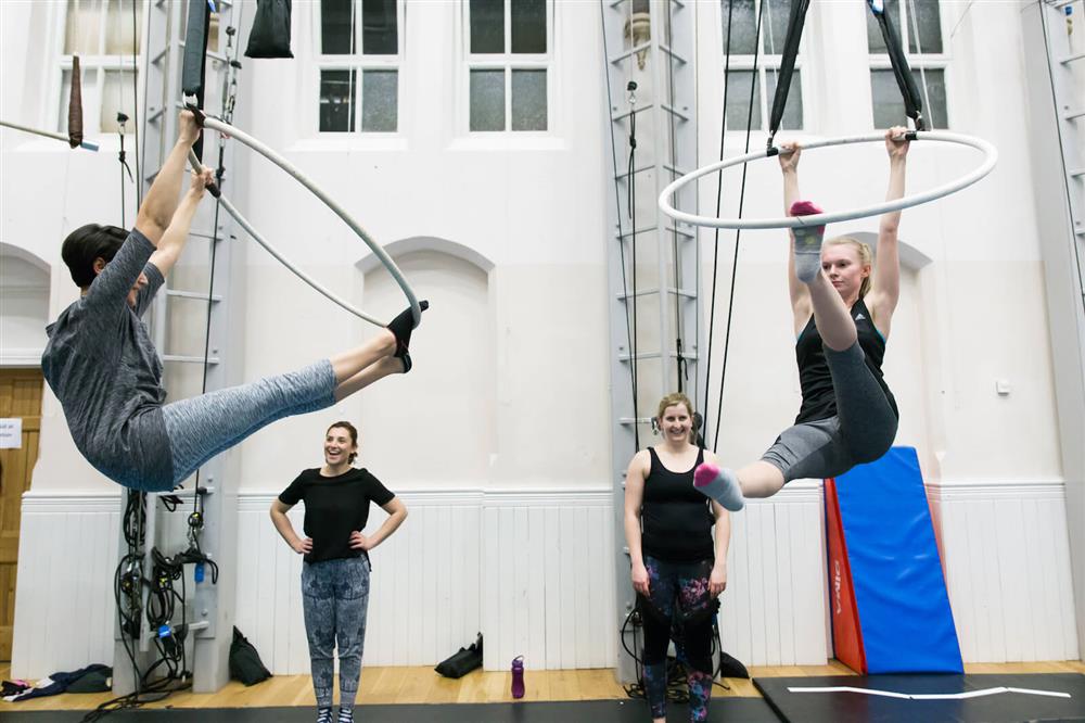 People training on aerial hoop