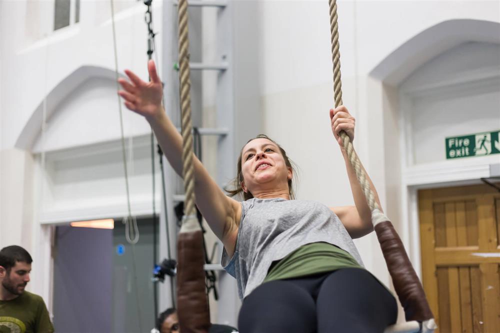 Person on a trapeze