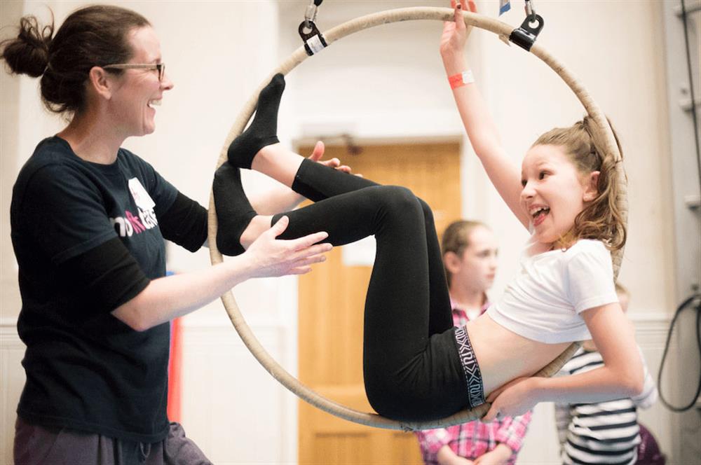 Child on aerial hoop